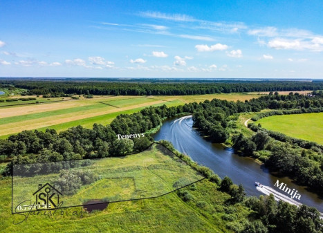 PRIE MINIJOS UPĖS PARDUODAMAS 72 ARŲ SKLYPAS SAKŪČIŲ KAIME