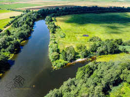 PRIE MINIJOS UPĖS PARDUODAMAS 72 ARŲ SKLYPAS SAKŪČIŲ KAIME 16